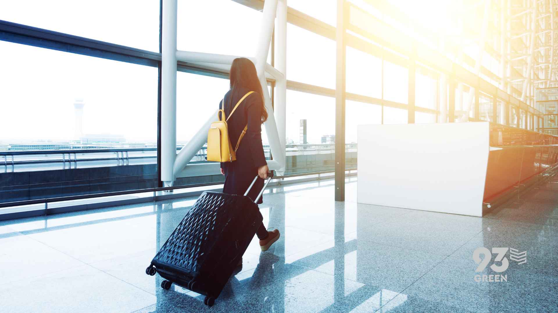 Woman traveling with suitcase - Convenient protein on the go